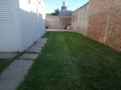 an empty alley with a brick wall and grass at Casa en San Francisco del monte de oro in San Francisco del Monte de Oro