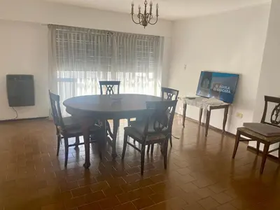 a dining room with a table and chairs at Julia Apparts - DEPARTAMENTO EN EL CENTRO DE LA CIUDAD in Cordoba