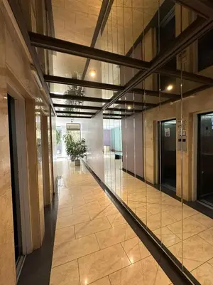 an empty hallway in a building with glass walls at Departamento 1 dorm con cochera Nueva Córdoba 1 E INVERHOME INMOBILIARIA in Cordoba
