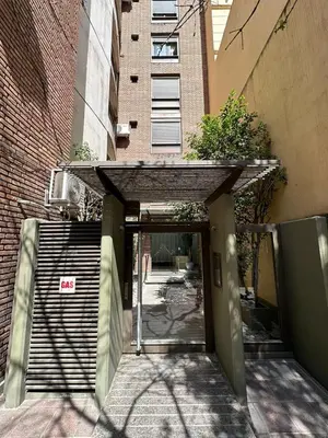 an entrance to a building with an open door at Departamento 1 dorm con cochera Nueva Córdoba 1 E INVERHOME INMOBILIARIA in Cordoba