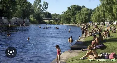 a group of people in the water at a park at Hostería Los Sauces in Mina Clavero