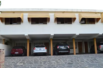 two cars parked in the garage of a building at Hostería Los Sauces in Mina Clavero