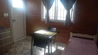 a bedroom with a desk and a bed and a window at Complejo soñado in Mina Clavero