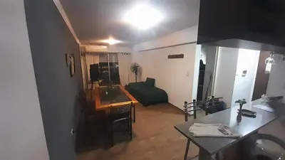 a room with a kitchen and a living room at Alquiler día Nueva Cordoba in Cordoba