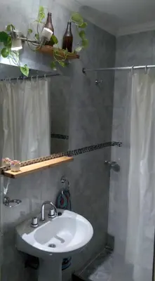 a bathroom with a sink and a shower at Alquiler día Nueva Cordoba in Cordoba