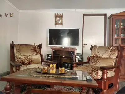 a living room with a coffee table and a tv at Duplex Tupungato in Villa Carlos Paz