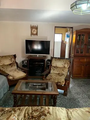 a living room with two couches and a tv at Duplex Tupungato in Villa Carlos Paz