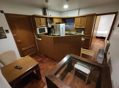 an overhead view of a small kitchen and living room at Abudé - Zona Norte, a cuadras de Sanatorio Allende Cerro, Hospital Privado y Estadio Kempes in Cordoba