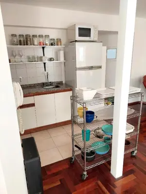 a kitchen with a cart with dishes on it at Dúplex de Diseño en Nueva Córdoba in Cordoba