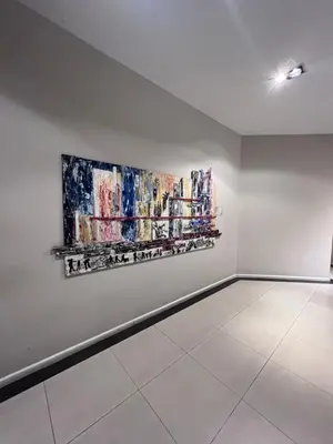 a room with two paintings on a wall at Departamento PREMIUM Córdoba in Cordoba