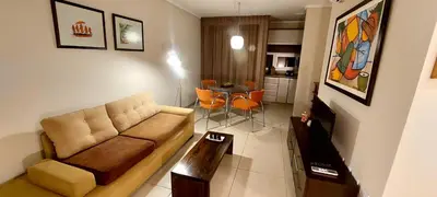a living room with a couch and a table at Departamento zona Tribunales in Cordoba