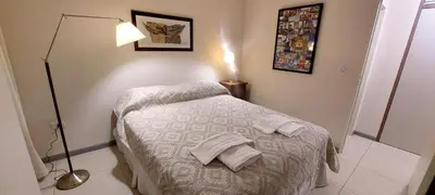 a small bedroom with a bed with towels on it at Departamento zona Tribunales in Cordoba