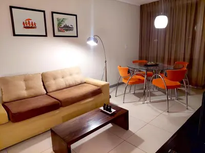a living room with a couch and a table at Departamento zona Tribunales in Cordoba