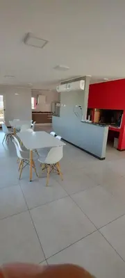 a kitchen with a table and chairs in a room at Descanso Berenice in Villa Carlos Paz