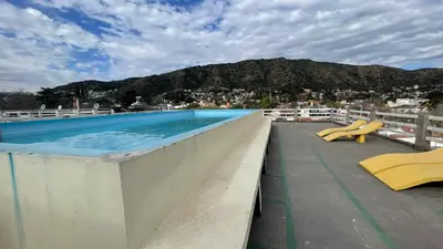 a swimming pool on the roof of a building at DEPARTAMENTO en VILLA CARLOS PAZ 4P in Villa Carlos Paz