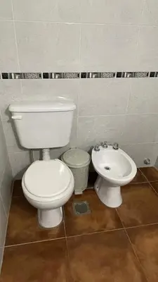 a bathroom with a toilet and a sink at DEPARTAMENTO en VILLA CARLOS PAZ 4P in Villa Carlos Paz