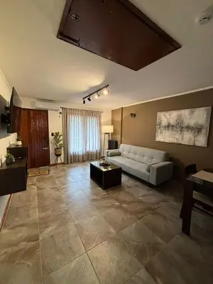 a living room with a couch and a table at The View in Villa General Belgrano