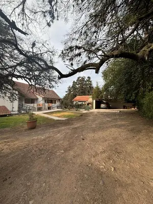 a dirt road in front of a house at The View in Villa General Belgrano