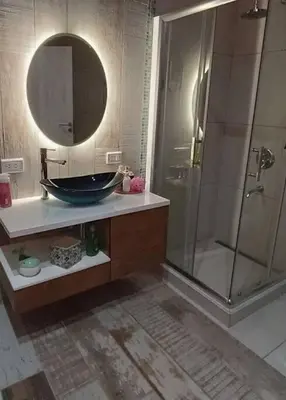 a bathroom with a sink and a shower with a mirror at Amawa Domo - escapada romántica en las sierras in San Francisco del Monte de Oro