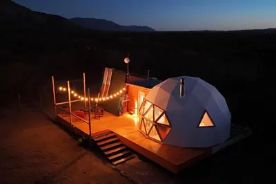 a large dome tent with lights on it at night at Amawa Domo - escapada romántica en las sierras in San Francisco del Monte de Oro