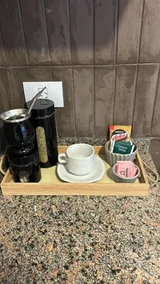 a wooden tray with a coffee maker and a bowl on it at Departamento balcones de Cofico in Cordoba