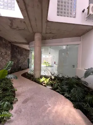 a large building with a large room with plants at De lo mejor en Barrio General Paz in Cordoba