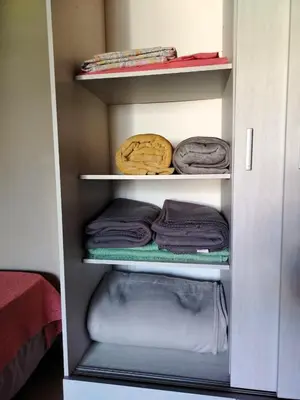 a closet with some folded towels and towels at Dúplex 250ms Peatonal in Villa Carlos Paz