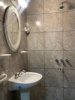 a bathroom with a sink and a mirror at Departamento Costanera in Villa Carlos Paz
