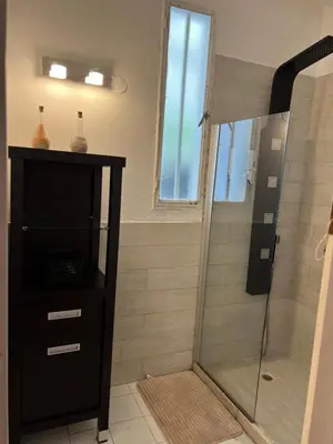 a bathroom with a shower with a glass door at ApartQ, depto entero, Villa Belgrano, Córdoba capital in Cordoba