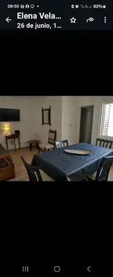 a picture of a living room with a table with a blue sheet at Center Córdoba Nize & Cozi in Cordoba