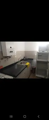 a kitchen with a sink and a counter top at Center Córdoba Nize & Cozi in Cordoba