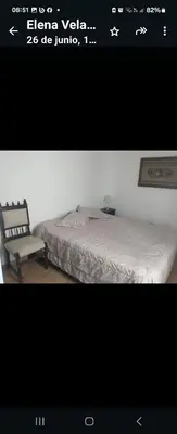 a picture of a bedroom with a bed and a chair at Center Córdoba Nize & Cozi in Cordoba