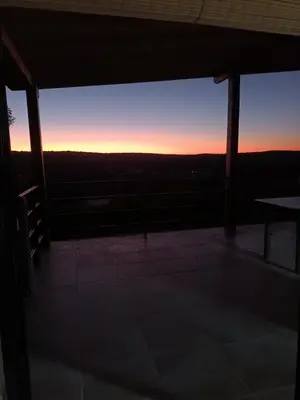 a view of the sunset from the roof of a building at Siu Kiu - Casa de Montaña in El Parador