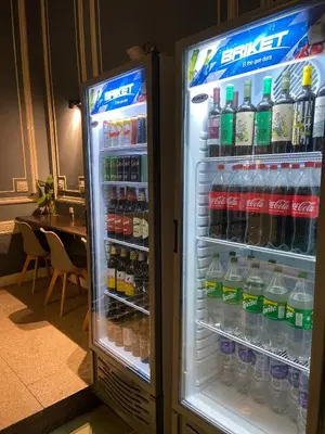 an open refrigerator filled with lots of drinks at Hostel Alvear in Cordoba