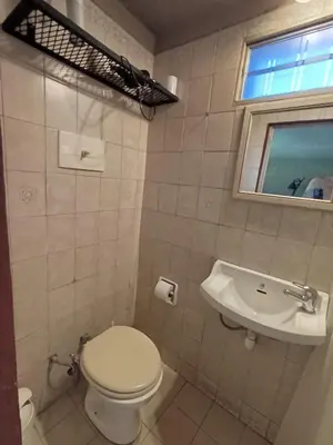 a bathroom with a toilet and a sink at Achaval-Torre in Cordoba