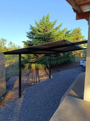 awning on the side of a house with a sidewalk at Casa Reartes in Los Reartes