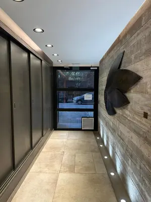 a hallway with a wall with a sculpture on it at Magnolia in Cordoba