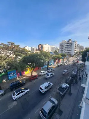 a city street with cars parked on the street at Departamento -Roma- Barrio General Paz - A una cuadra de 24 de septiembre y enfrente del Polideportivo By Apartcba in Cordoba