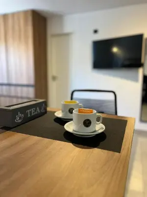 two cups of coffee sitting on top of a table at JC Apart in Cordoba