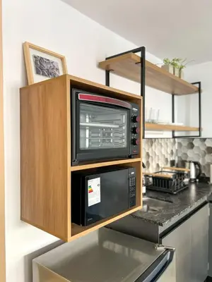 a microwave oven sitting on top of a kitchen counter at JC Apart 3 in Cordoba