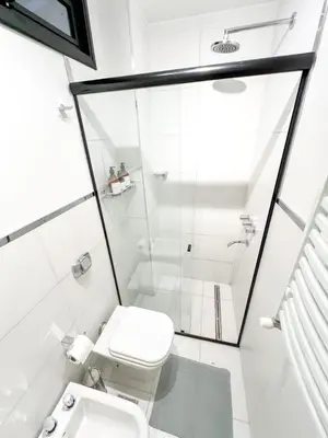 a white bathroom with a toilet and a shower at JC Apart 3 in Cordoba
