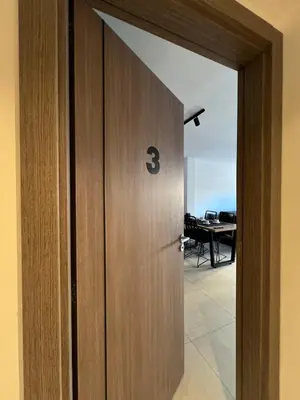 a door with the number three on it in a room at JC Apart 3 in Cordoba