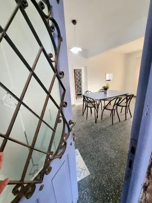 a view of a room with a table and chairs at Casa Irupé in Embalse