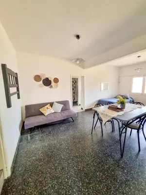 a living room with a couch and a table at Casa Irupé in Embalse