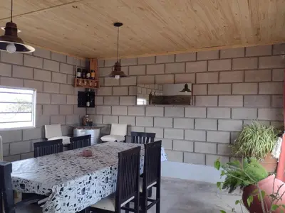 a dining room with a table and chairs at Portal del Sol in Villa Yacanto