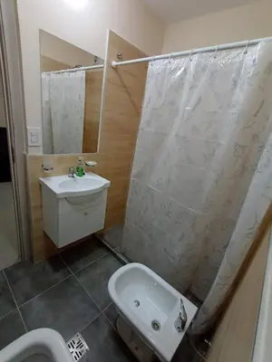 a bathroom with a shower and a sink and a toilet at Hermoso Departamento en muy bonita zona de Alta Córdoba, nuevo a estrenar in Cordoba
