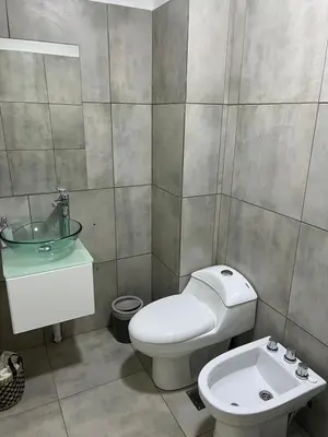 a bathroom with a toilet and a sink at CALASANz PREMIUM in Cordoba