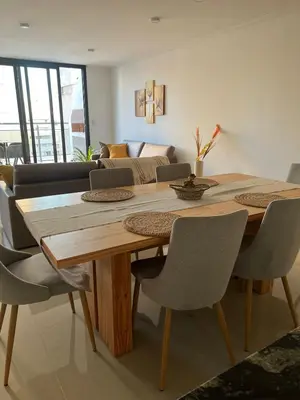 a dining room table with chairs and a couch at CALASANz PREMIUM in Cordoba