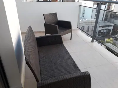 two chairs sitting on top of a balcony at CALASANz PREMIUM in Cordoba