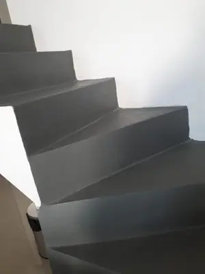 a set of black stairs in a room at CALASANz PREMIUM in Cordoba